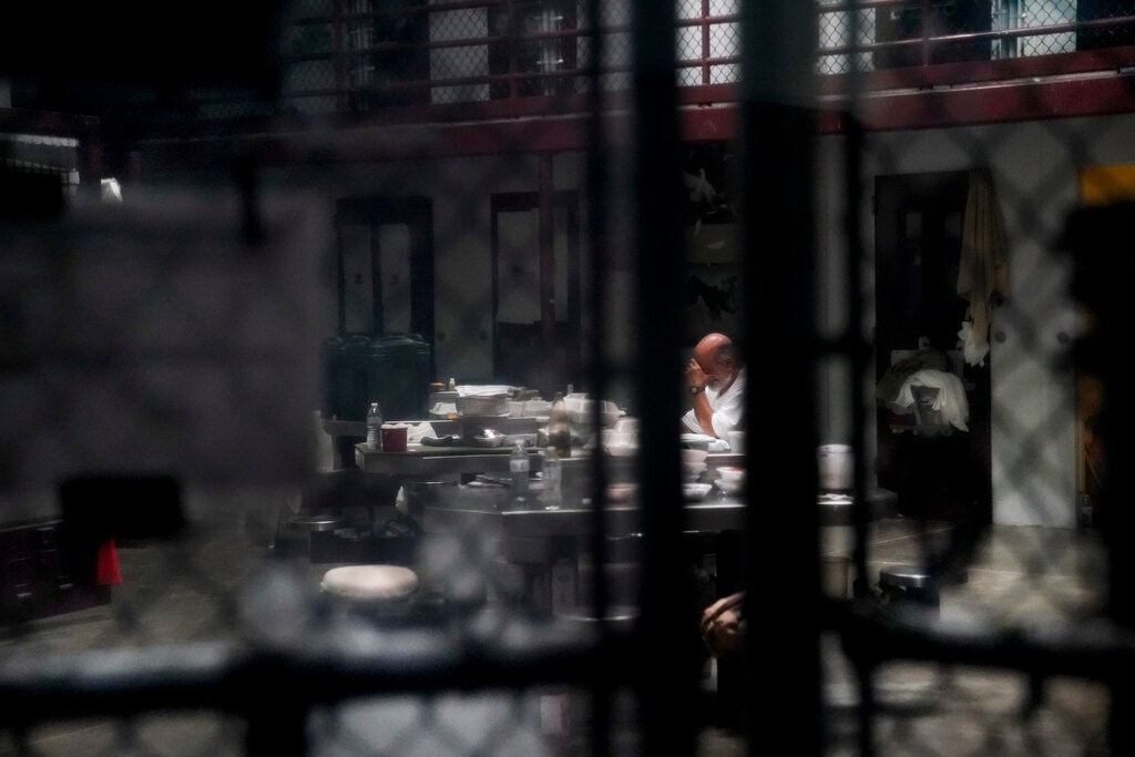 A detainee at Camp 6 of the Guantánamo Bay detention camp in 2019. Coronavirus protection measures led to cancelation of some meetings between detainees and delegates from the International Committee of the Red Cross. Image by Doug Mills/The New York Times. United States, 2019. A detainee at Camp 6 of the Guantánamo Bay detention camp in 2019. Coronavirus protection measures led to cancelation of some meetings between detainees and delegates from the International Committee of the Red Cross. Image by Doug Mills/The New York Times. United States, 2019.