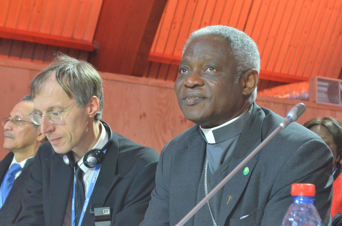 Cardinal Peter Turkson of Ghana, right, was Pope Francis' point man in charge of developing the research and writing "Laudato Si, On Care for Our Common Home." Image by Justin Catanoso. France, 2015. Media file: dsc_0204.jpg