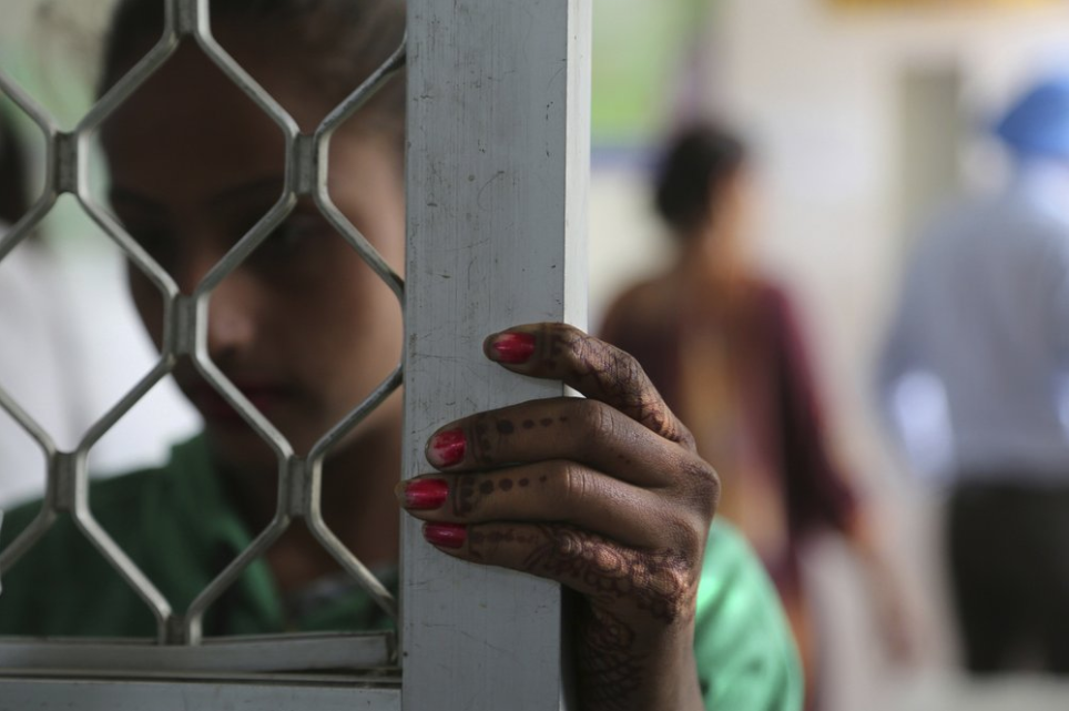 In this Thursday, Oct. 31, 2019, photo, a recovering tramadol user waits for her medication at a de-addiction center in Kapurthala, in the northern Indian state of Punjab. The pills were everywhere, as legitimate medication sold in pharmacies, but also illicit counterfeits hawked by itinerant peddlers and street vendors. India has twice the global average of illicit opiate consumption. Researchers estimate about 4 million Indians use heroin or other opioids, and a quarter of them live in the Punjab, India's agricultural heartland bordering Pakistan. Image by Channi Anand / AP Photo. India, 2019. In this Thursday, Oct. 31, 2019, photo, a recovering tramadol user waits for her medication at a de-addiction center in Kapurthala, in the northern Indian state of Punjab. The pills were everywhere, as legitimate medication sold in pharmacies, but also illicit counterfeits hawked by itinerant peddlers and street vendors. India has twice the global average of illicit opiate consumption. Researchers estimate about 4 million Indians use heroin or other opioids, and a quarter of them live in the Punjab, India…