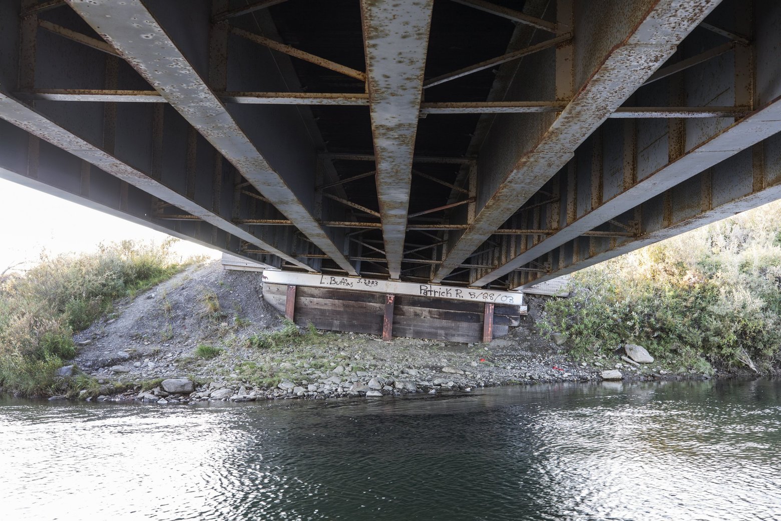 Thawing permafrost has caused a tilt on the pilings that support this bridge on the Nome-Teller Highway, requiring increased maintenance as the Northwest Alaska climate warms. Image by Steve Ringman. United States, 2019. Thawing permafrost has caused a tilt on the pilings that support this bridge on the Nome-Teller Highway, requiring increased maintenance as the Northwest Alaska climate warms. Image by Steve Ringman. United States, 2019.