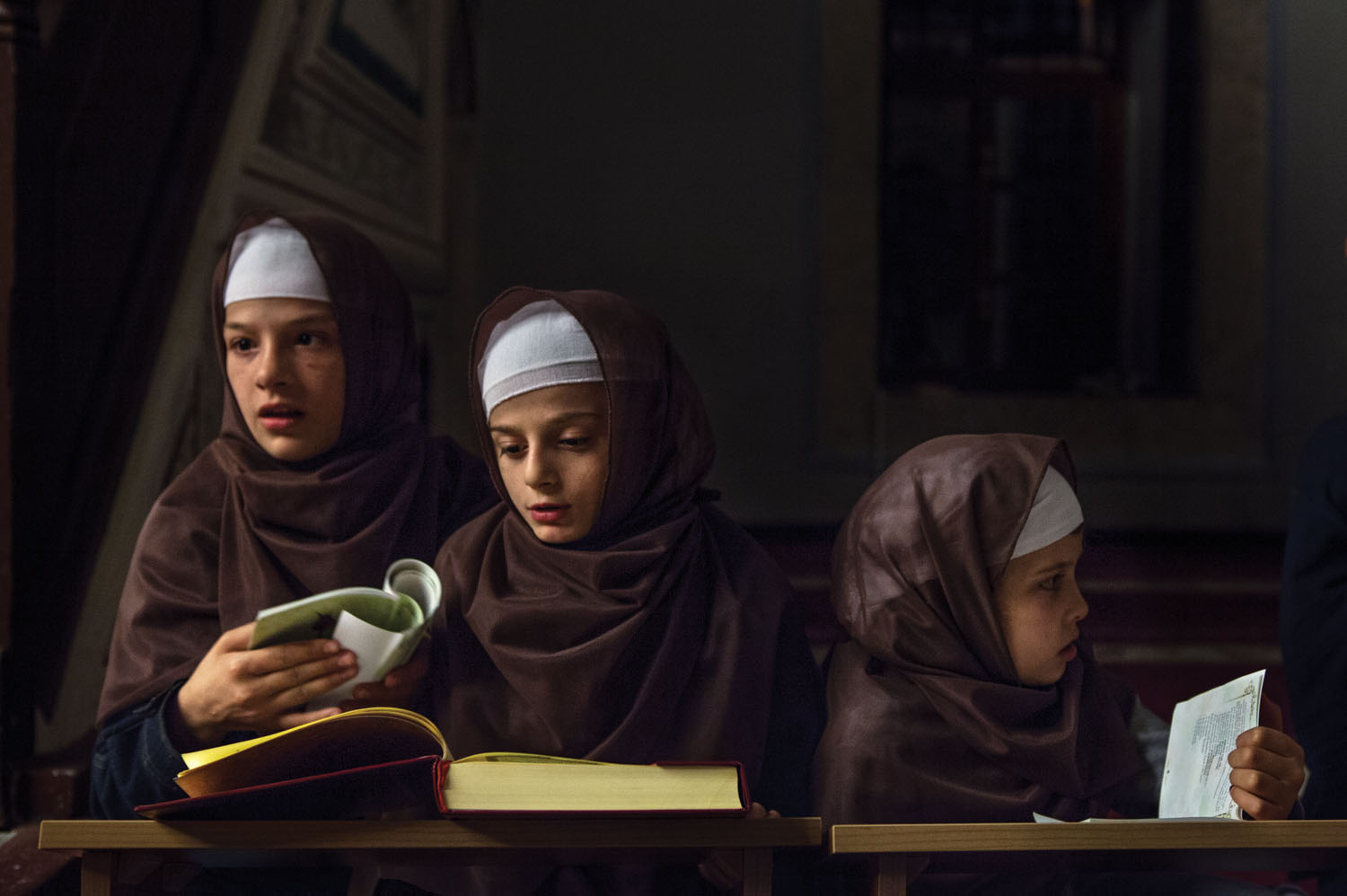 Albanian children studying the Koran. Image by Monika Bulaj. Kosovo, 2013. Albanian children studying the Koran. Image by Monika Bulaj. Kosovo, 2013.