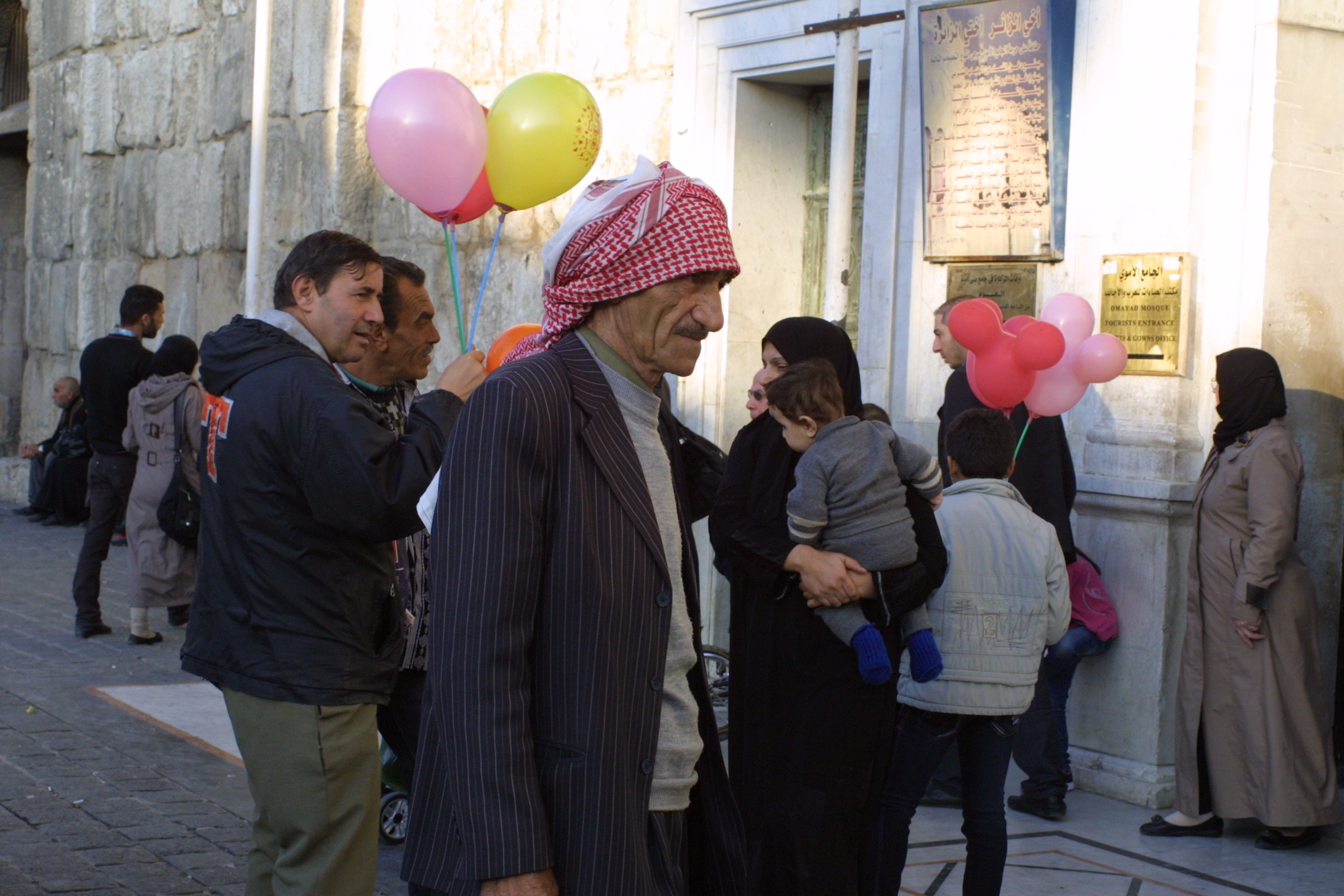 Shia and Sunni enter the Omayyad Mosque in Damascus. The civil war has increasingly become a sectarian fight overlaying political and economic conflict. Image by Reese Erlich. Syria, 2013.