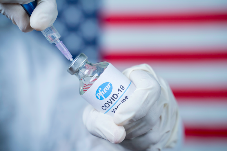 Doctor holding a Pfizer/Biontech vaccine. Image by lakshmiprasada S / Shutterstock. 2020. Doctor holding a Pfizer/Biontech vaccine. Image by lakshmiprasada S / Shutterstock. 2020.