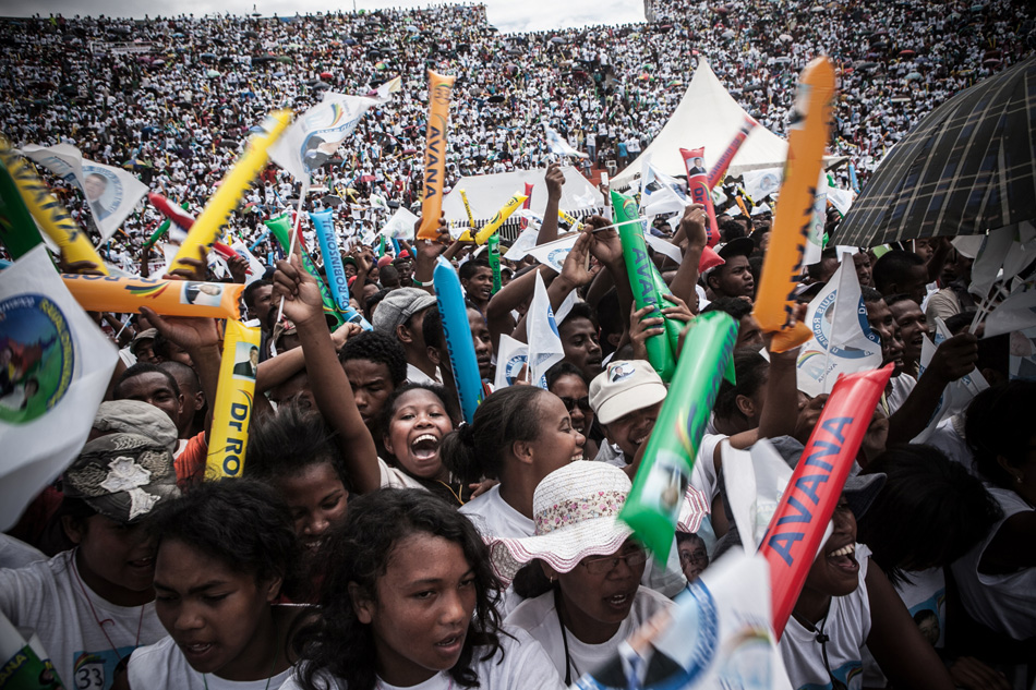 Supporters of presidential candidate Jean Louis Robinson cheer at the candidate's last rally before the December 20 runoff. Image by Rijasolo / Riva Press. Madagascar, 2013.