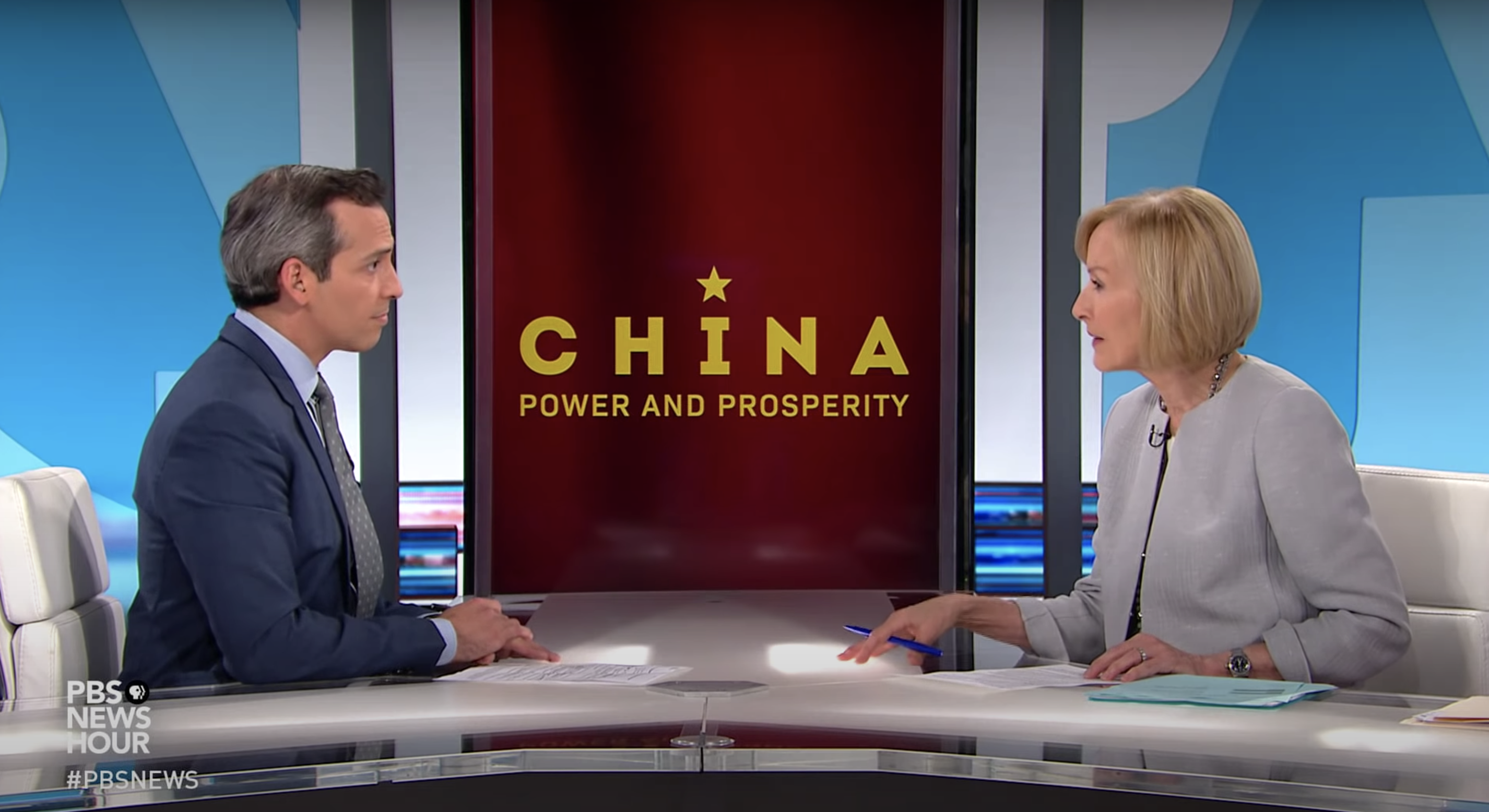 Nick Schifrin speaks with Judy Woodruff about his series on China for PBS NewsHour. Media file: maxres1.jpg
