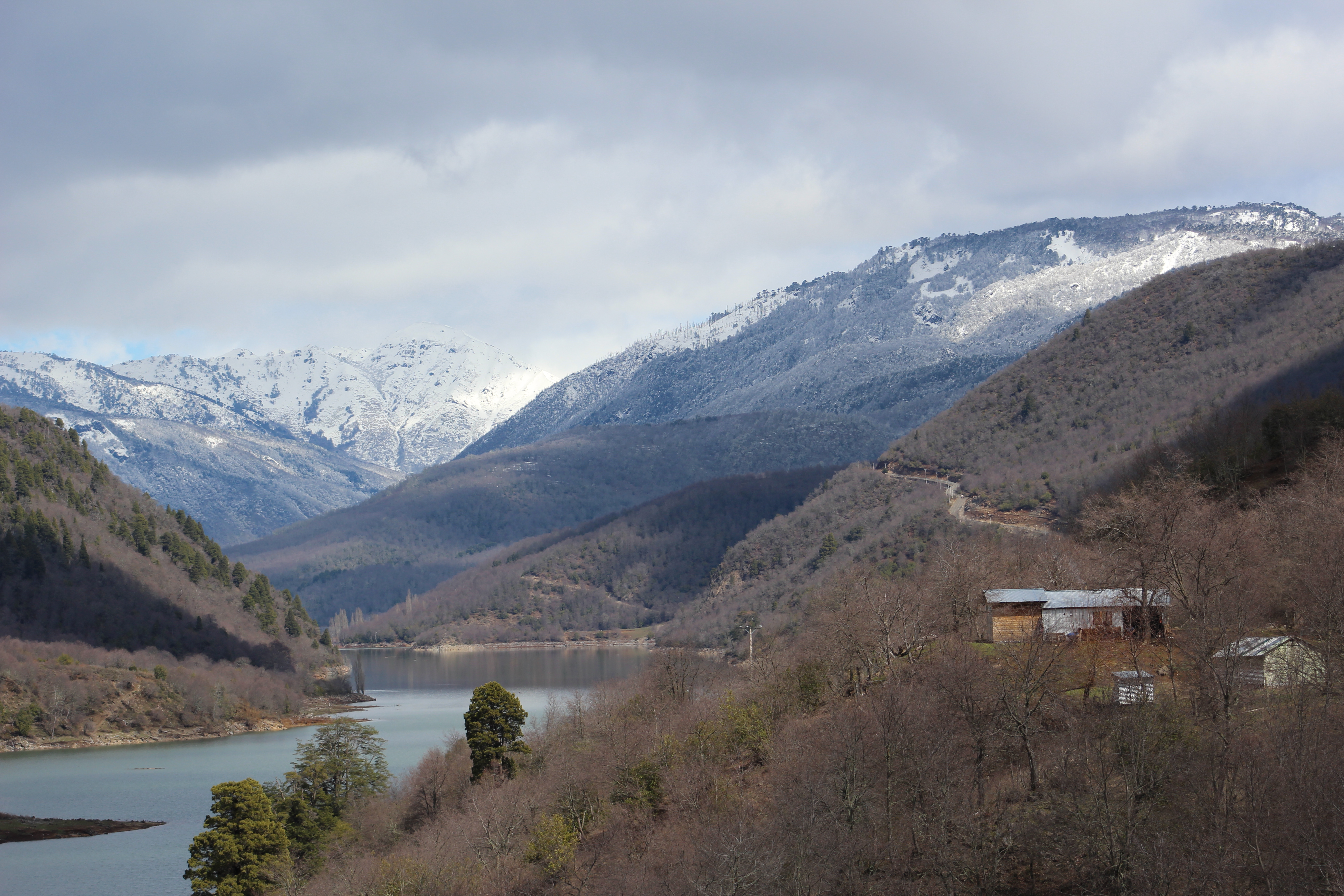 A Pehuenche house overlooks the flooded portion of the Bío Bío river. Image by Max Radwin. Chile, 2015. Media file: 9915housewithmountains1.jpg