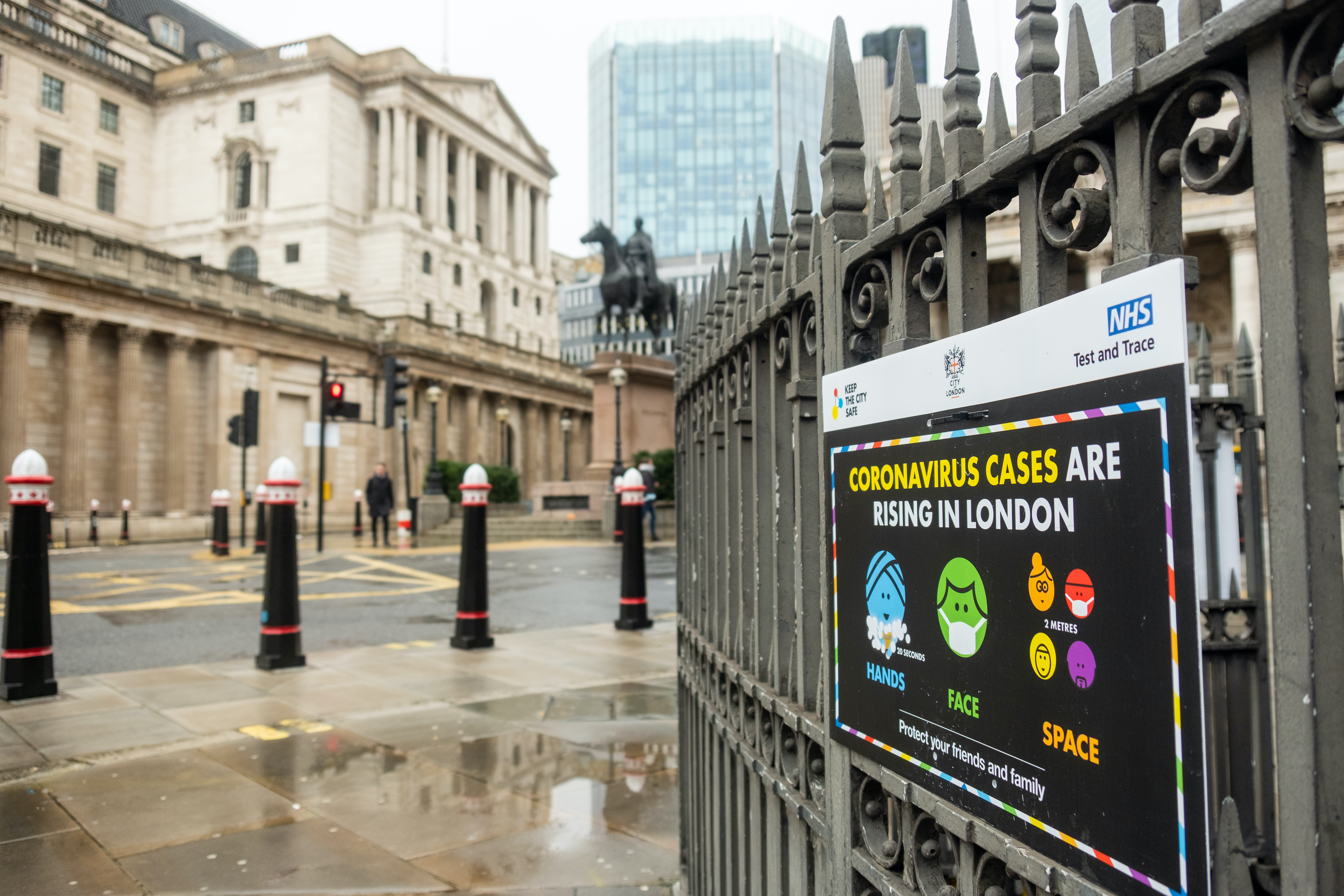 On December 21st, a sign warning of rising coronavirus cases outside the Bank Of England in days following London entering Tier 4 lockdown. Image by Willy Barton / Shutterstock. United Kingdom, 2020. On December 21st, a sign warning of rising coronavirus cases outside the Bank Of England in days following London entering Tier 4 lockdown. Image by Willy Barton / Shutterstock. United Kingdom, 2020.