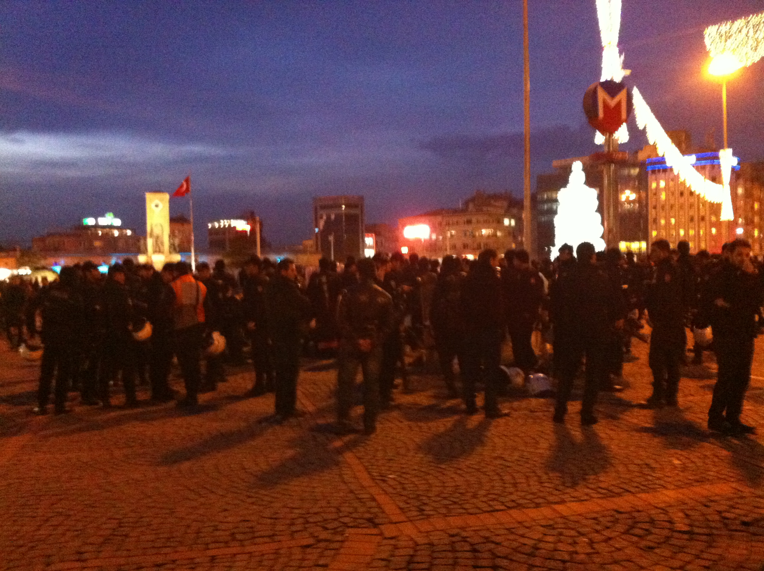Riot police position themselves near the Taksim Square metro station on Dec. 27, 2013, waiting for anti-corruption protests to begin. Image by Jenna Krajeski. Turkey, 2013. Media file: img_1376.jpg