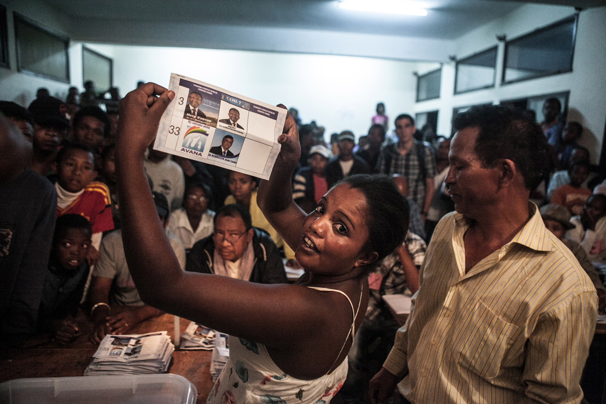 Electoral agents count votes at a polling station in Antananarivo, Madagascar on December 20, 2013 after the second round of presidential election. Image by RIJASOLO / RIVA PRESS. Madagascar, 2013.