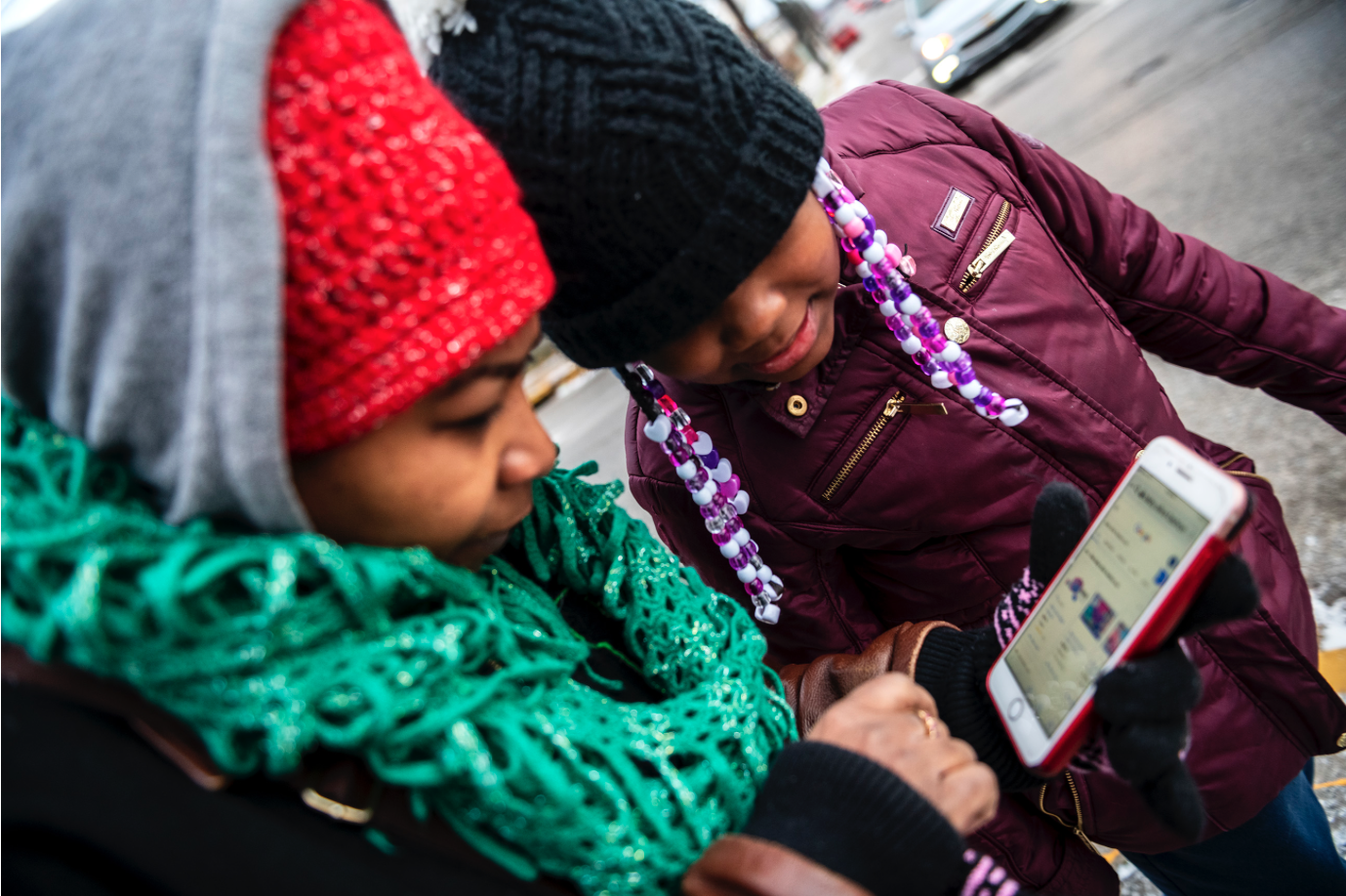 Nicole Glaze owner of Great Start Day Care in North Braddock, left, and Kee’Miyah West, 8, look at Kee'Miyah's Christmas toy wishlist. Image by Michael M. Santiago/Post-Gazette. United States, 2019. Nicole Glaze owner of Great Start Day Care in North Braddock, left, and Kee’Miyah West, 8, look at Kee'Miyah's Christmas toy wishlist. Image by Michael M. Santiago/Post-Gazette. United States, 2019.
