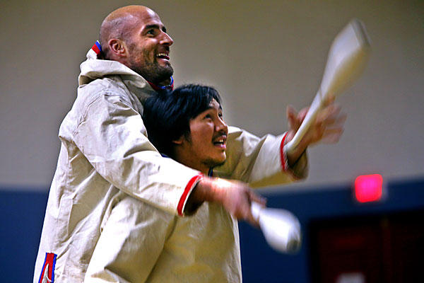 Guillaume Saladin (l.) practices a juggling routine with Terry Uyarak in Iqaluit, Nunavut, a Canadian federal territory. Mr. Saladin stayed in Nunavut as a child, with his anthropologist father. Image by Michele McDonald.