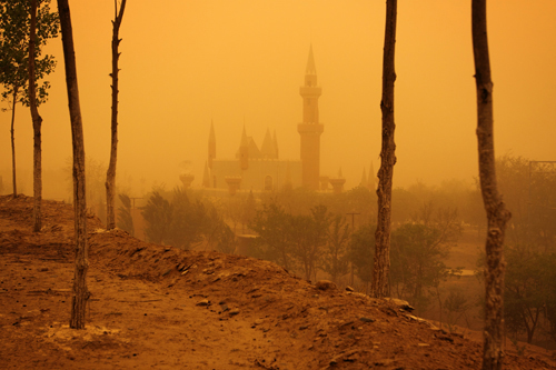 A sandstorm encapsulates a mock castle in the desert tourist park of Shapotou in Ningxia Province. The park is situated on the edges of the Tengger desert hence is regularly bombarded by sandstorms. 1