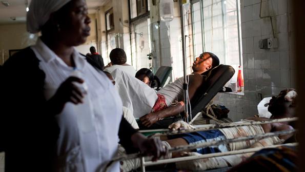 Bombing victims at the casualty ward of the Gwagwadala Specialist Hospital in Madalla. Image by Bénédicte Kurzen. Nigeria, 2012. Media file: 20120114_SSP503_1_0.jpg
