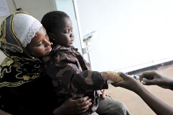 Swabura Namiiro, 4, receives care at the Uganda Cancer Institute in Kampala. Her family discovered the institute had many patients with leukemia. "This gave us a sense of support and gave us some strength," Swabura's mother says. Image by Jacqueline Koch. Uganda, 2012. Media file: 2019906472.jpg