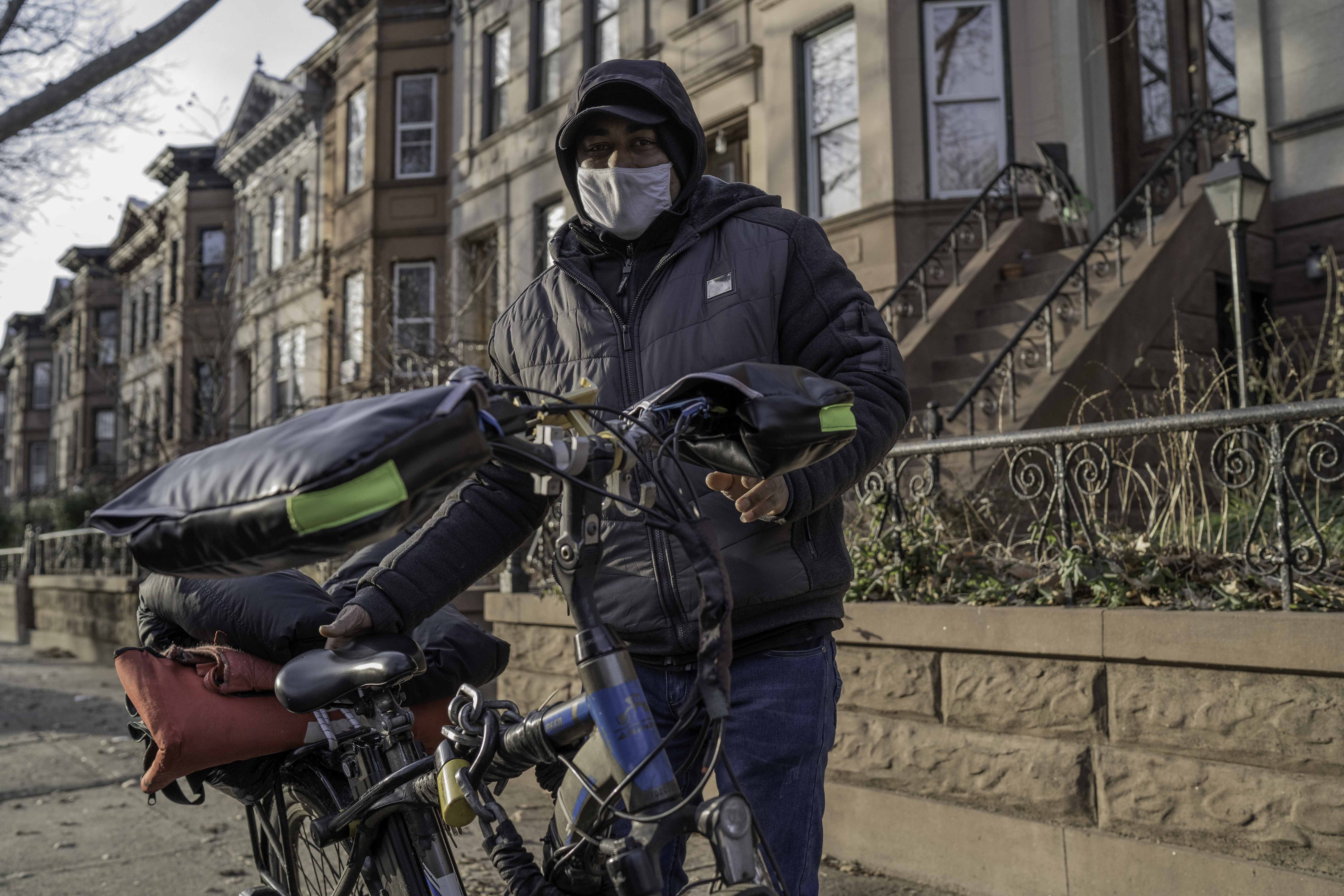 Ripon stands next to his delivery bike in Brooklyn. Image by Bruno Federico. United States, 2021.