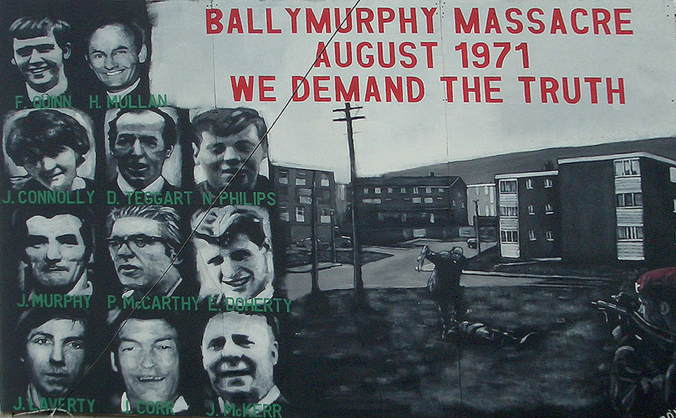 A memorial mural to the victims of the Ballymurphy massacre that reads, "The Ballymurphy Massacre August 1971 We demand the truth".