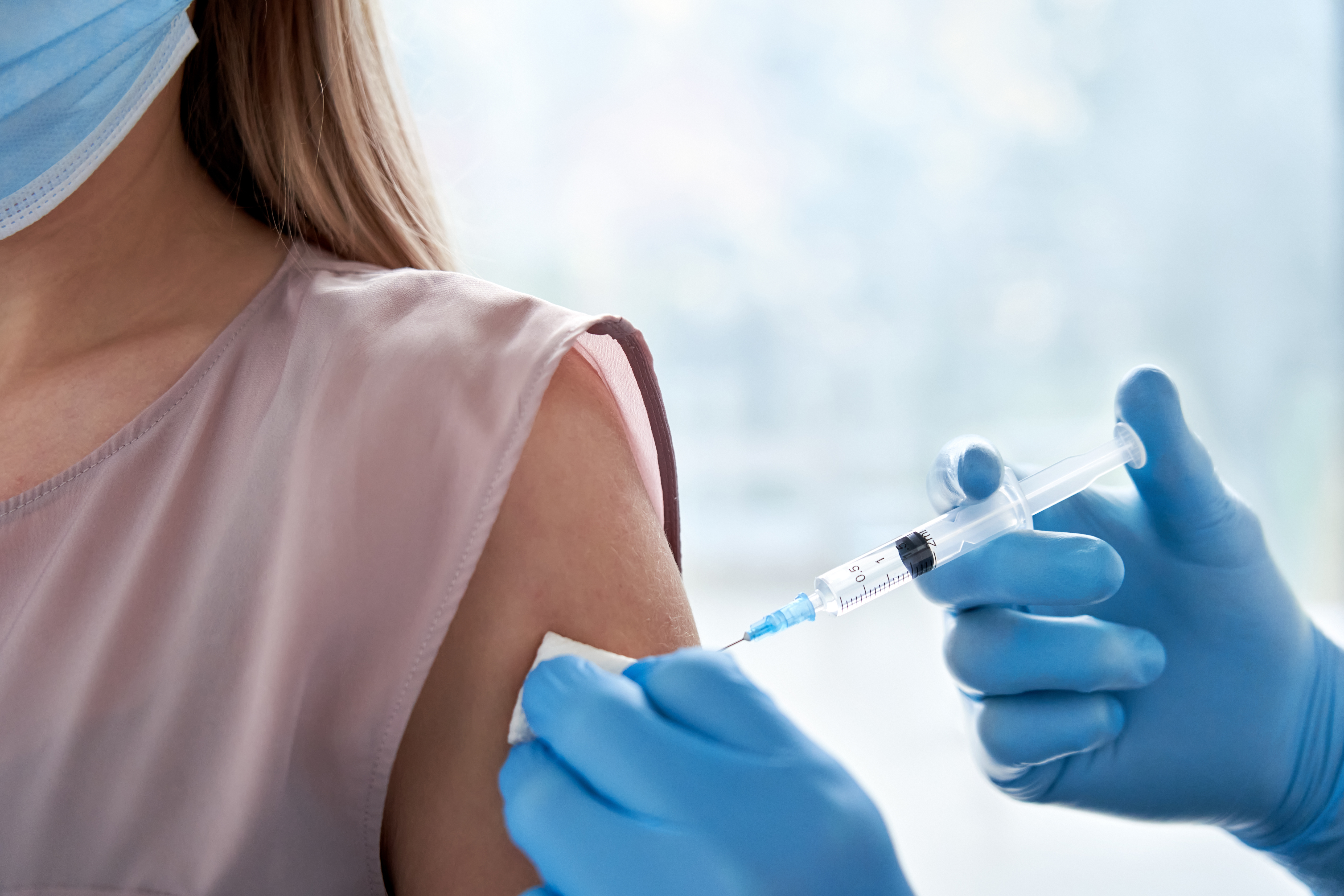 shutterstock_1859217856.jpg Someone getting the vaccine,