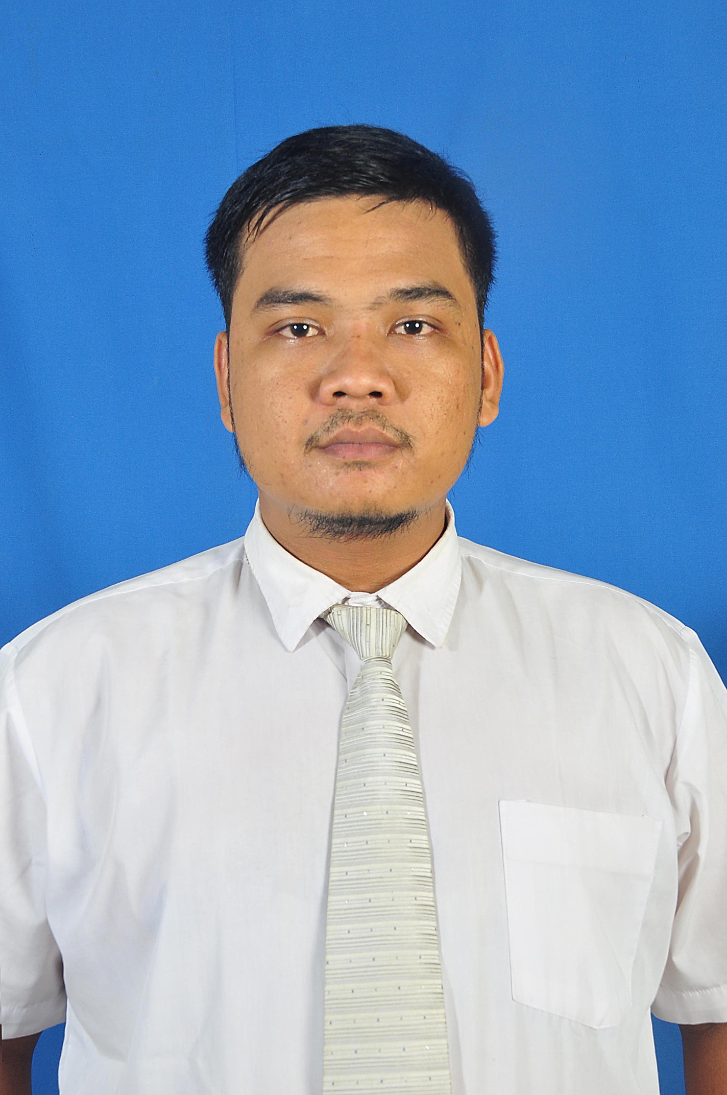 A person wears a white shirt with a white tie.