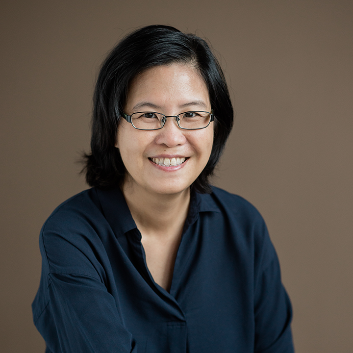 Image of a person wearing glasses and a dark blue shirt.