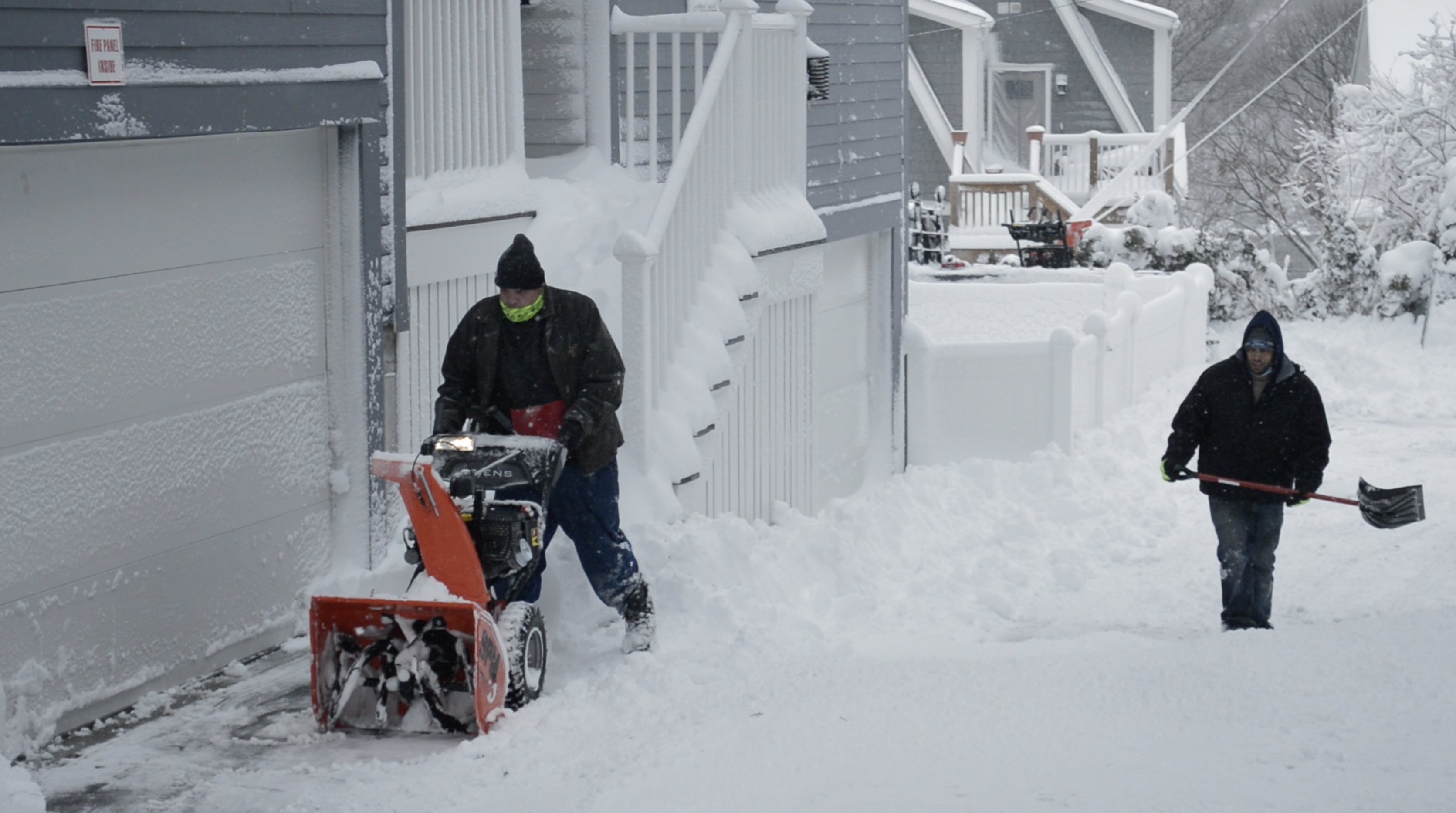 Screen-Shot-2021-11-11-at-55458-PM.png two people plowing snow