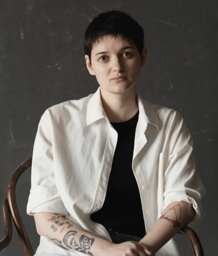 Woman sits on a chair
