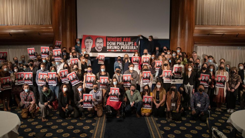 Looking for Dom Phillips and Bruno Pereira Pulitzer Center staff members, grantees, and Fellows hold "Where are Dom Phillips & Bruno Pereira?" posters at the Center's annual conference, Interconnected: Reporting the Climate Crisis.