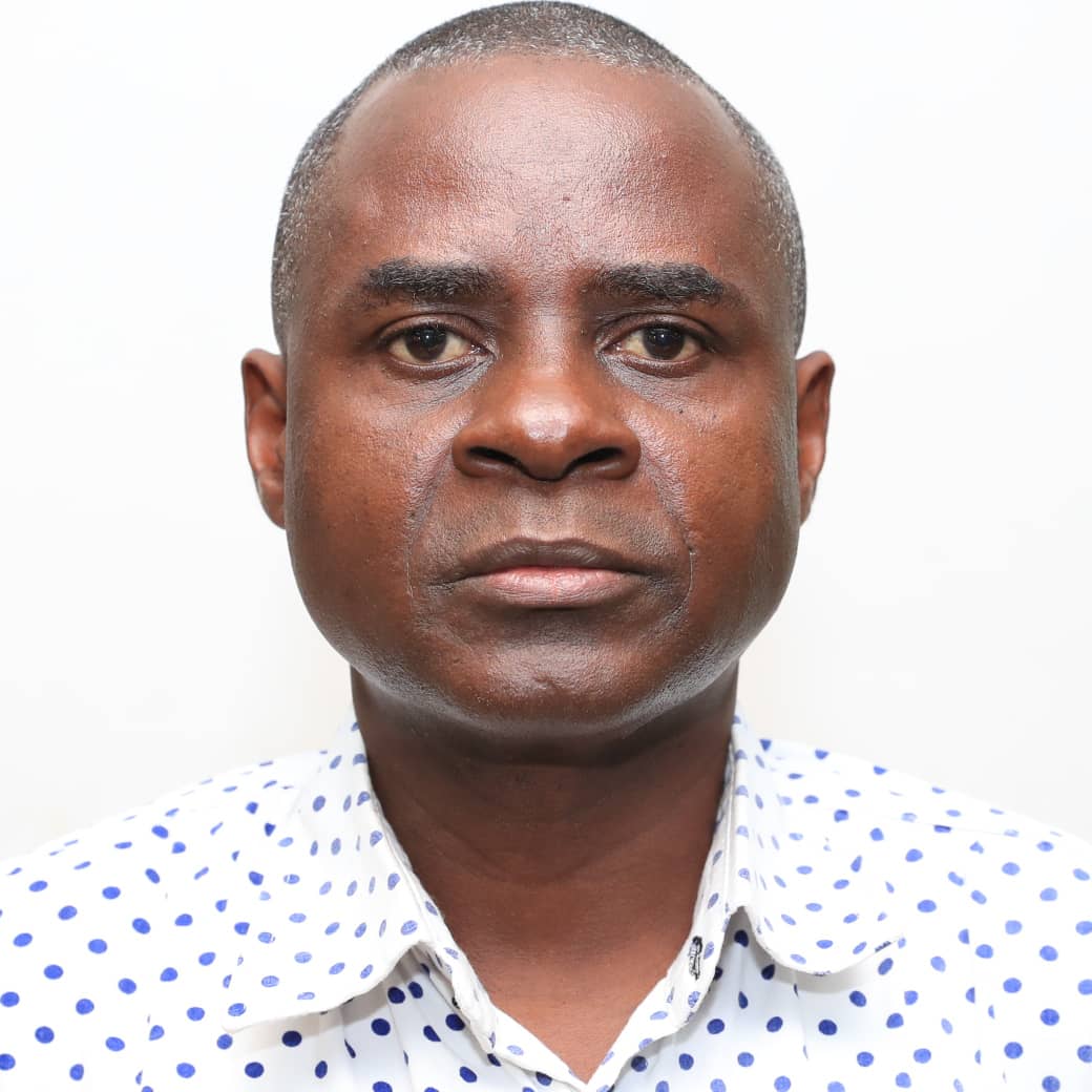 A person wearing a white patterned shirt.