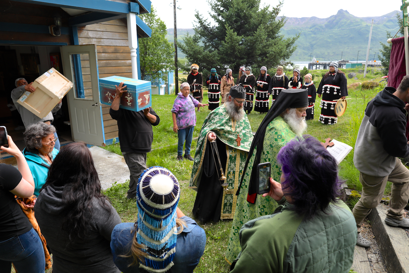 AnastasiaCoffin1 A man carries a small blue coffin at a Native American ceremony