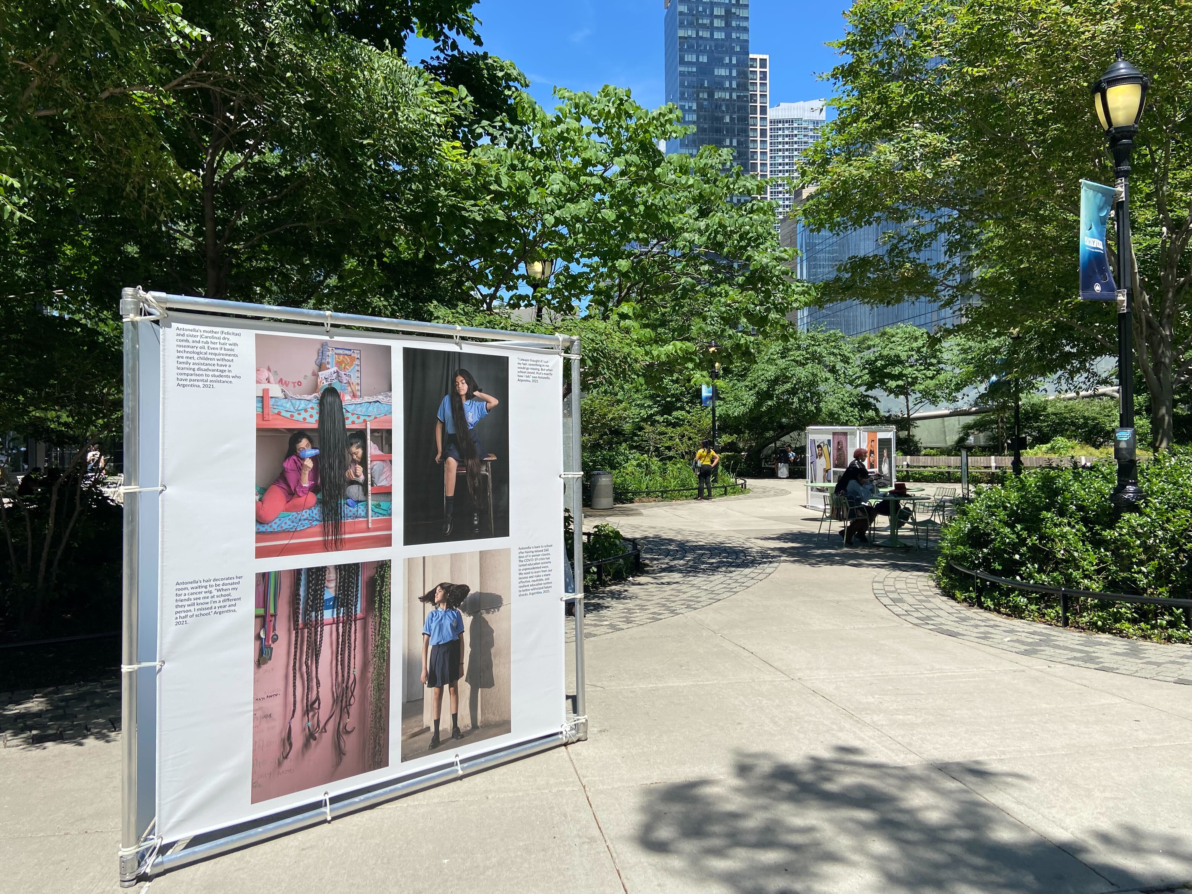 Two exhibits stand in a park