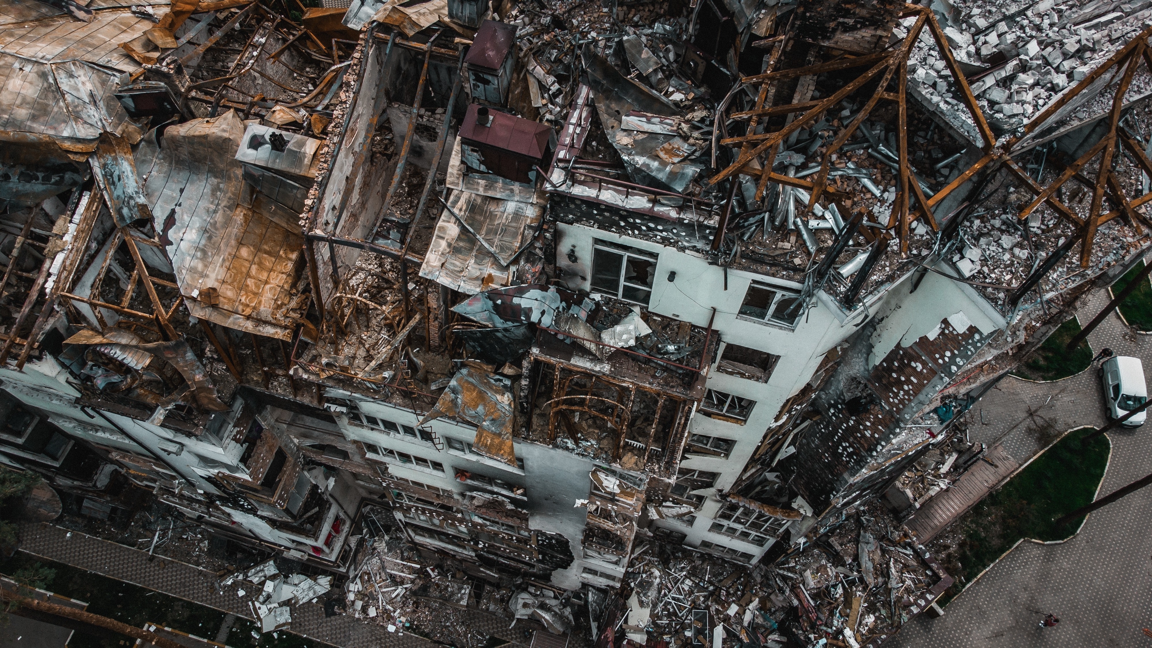 shutterstock_2158858641.jpg an aerial shot of ruined buildings in war-torn Ukraine