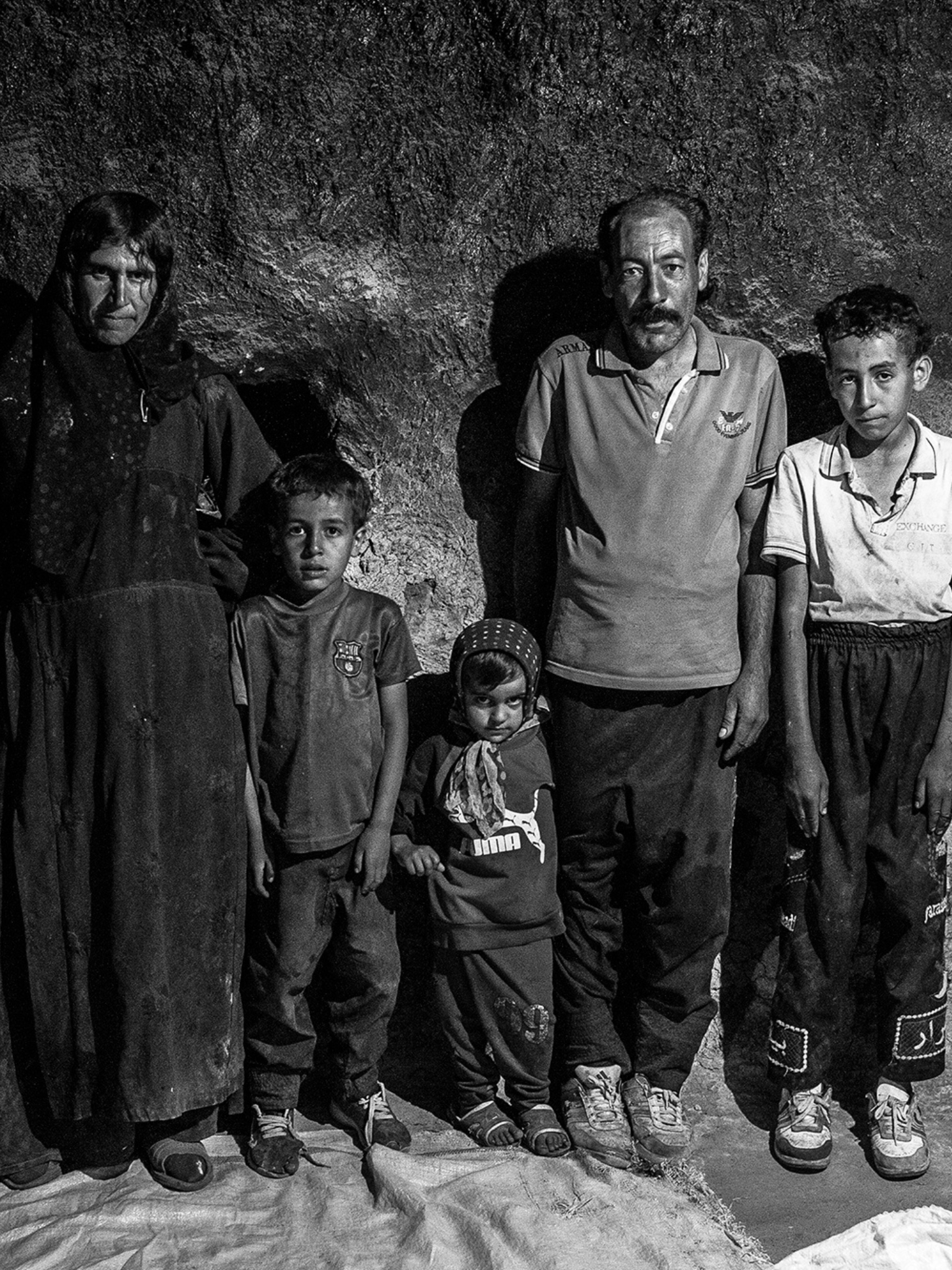 NEW S. Copy of Vertical thumbnail template 34 (1536 × 2048px) template (2).png A family poses for a picture.