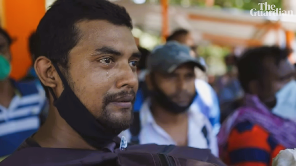A man cries as migrant laborers are forced to leave the cities for COVID lockdown in India. From The Guardian documentary "The Great Abandonment"