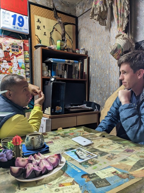The writer speaks with a Bunun medical healer, Yibi JIang, in Jiana, Taiwan.