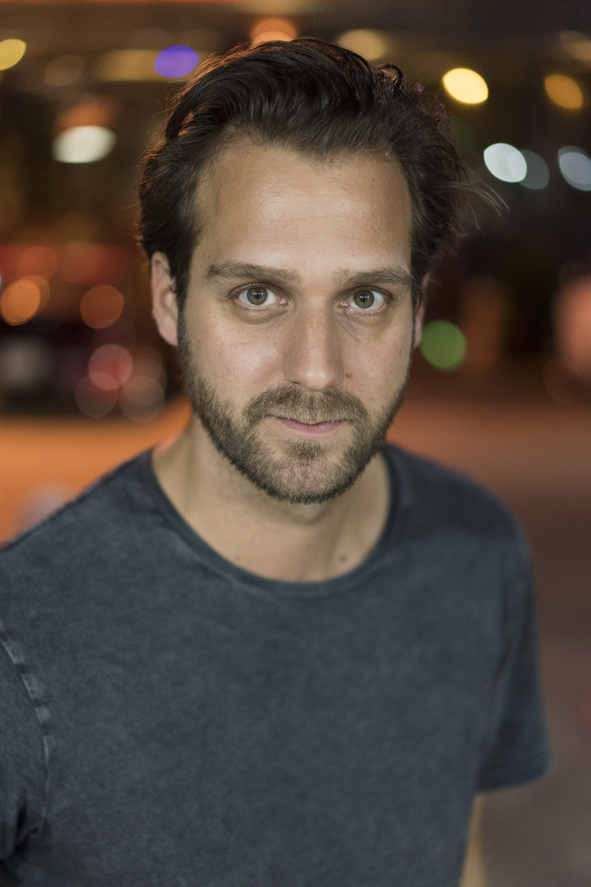 A man wearing a grey shirt