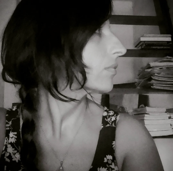 Black and white side profile of a woman with dark hair