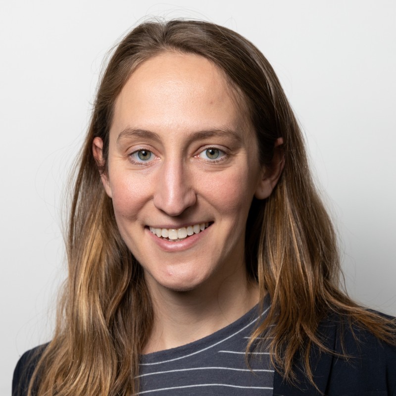 A woman with long light hair wearing a striped shirt