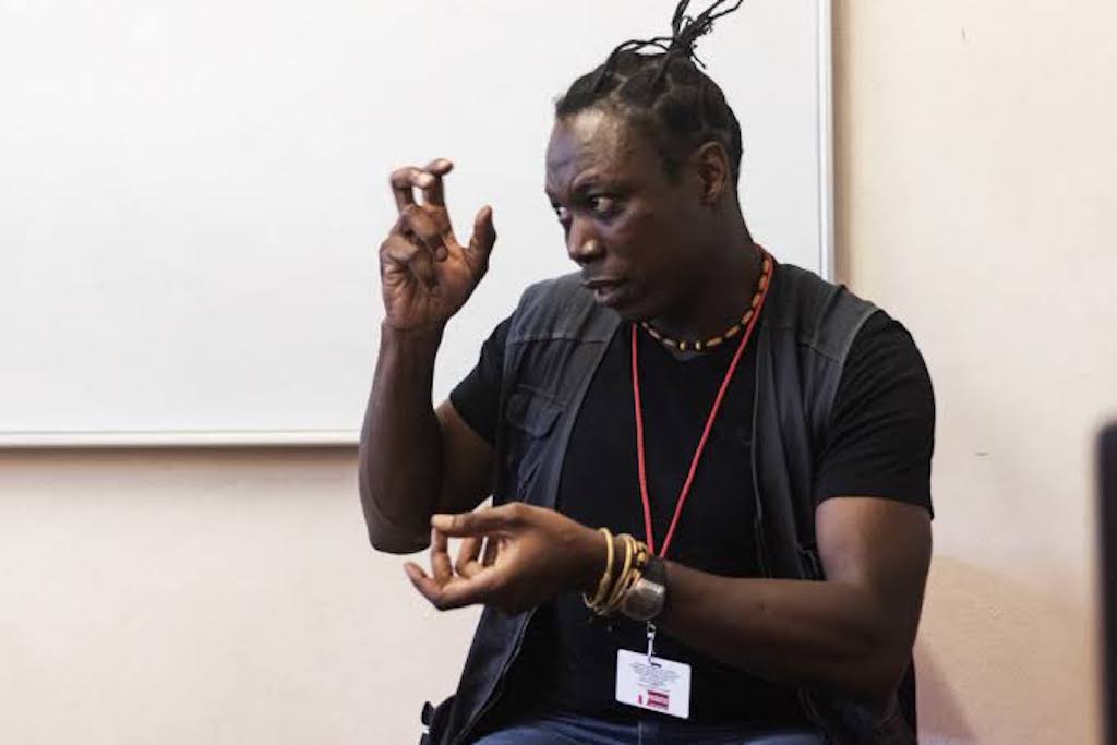 Image of Estacio giving a talk