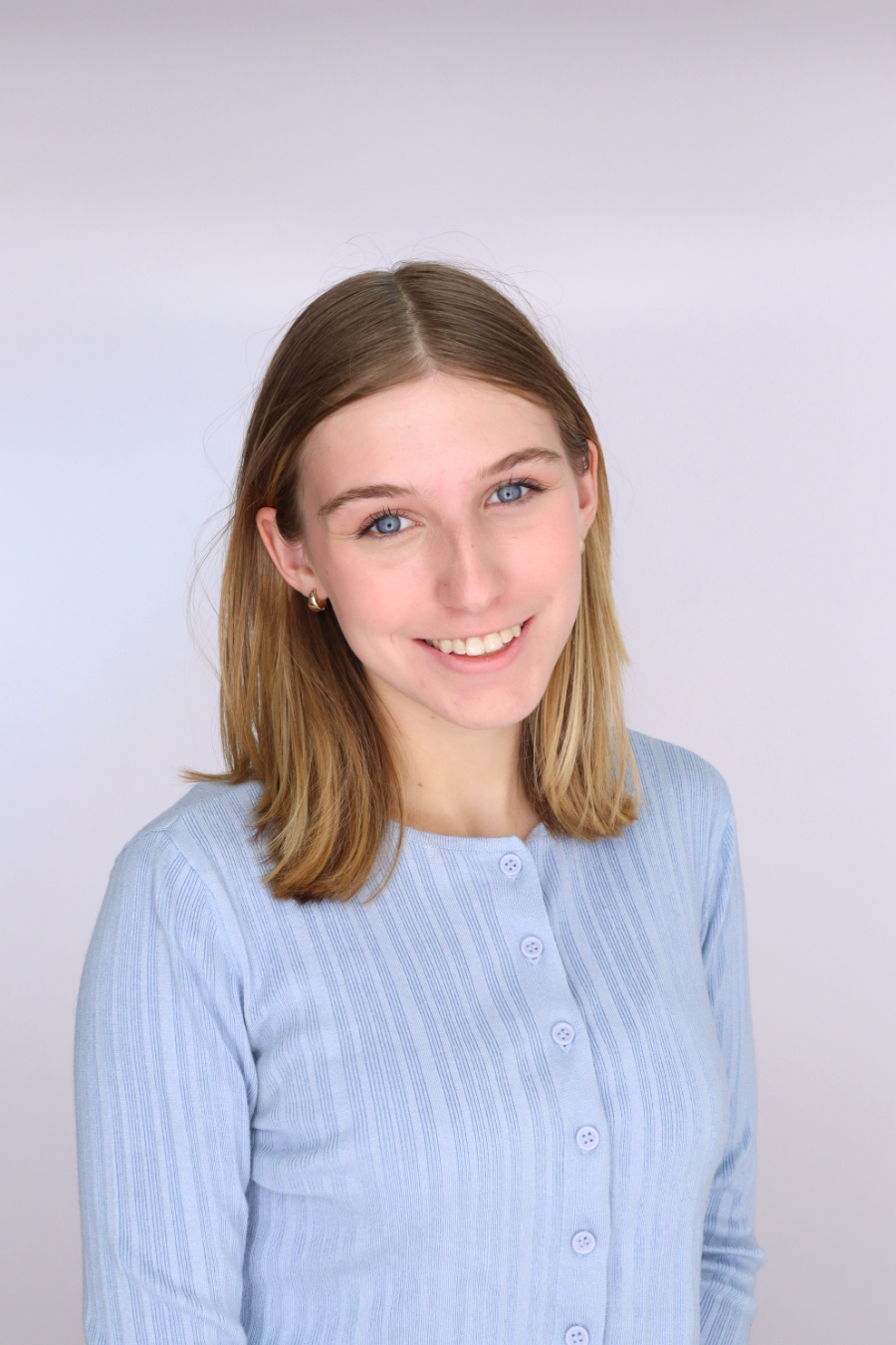 Headshot of Georgia with blue shirt