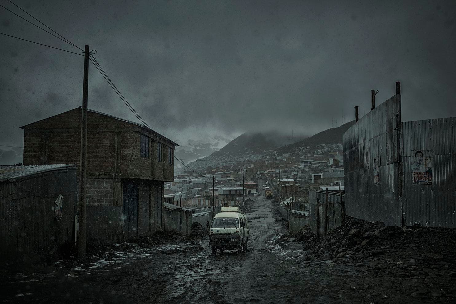 Wet snow immediately melts as it touches the ground, contributing to the muddy squalor at La Rinconada mine. Peru, 2019. Image by James Whitlow Delano. Wet snow immediately melts as it touches the ground, contributing to the muddy squalor at La Rinconada mine. Peru, 2019. Image by James Whitlow Delano.