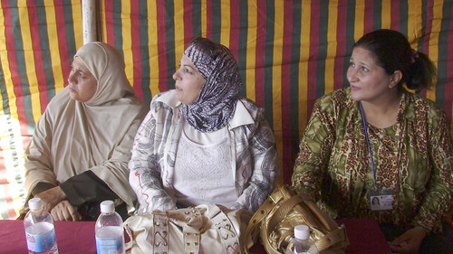 Rusul Muhamad, Nadia Abbas and Laila Ibrahim, who came to Jordan after the U.S.-led invasion in 2003, listen to announcements at a gathering for Iraqi refugees in Amman. (Baltimore Sun photo by Matthew Hay Brown / December 4, 2008) 1