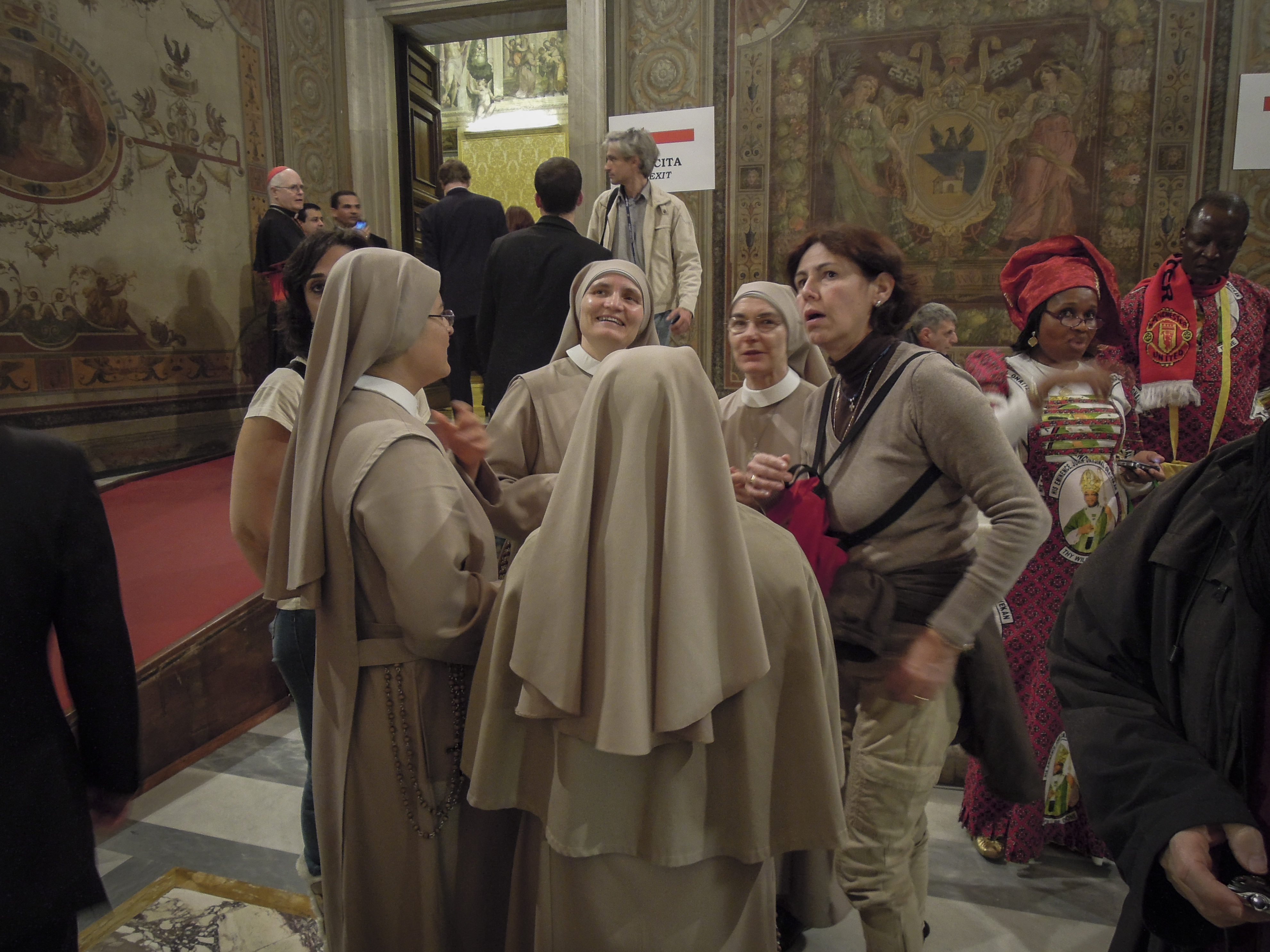 Nuns celebrate the appointment of new cardinals at a reception in the Apostolic Palace, Image by Jason Berry. Vatican City, 2012. Media file: DSCN0601-2.jpg