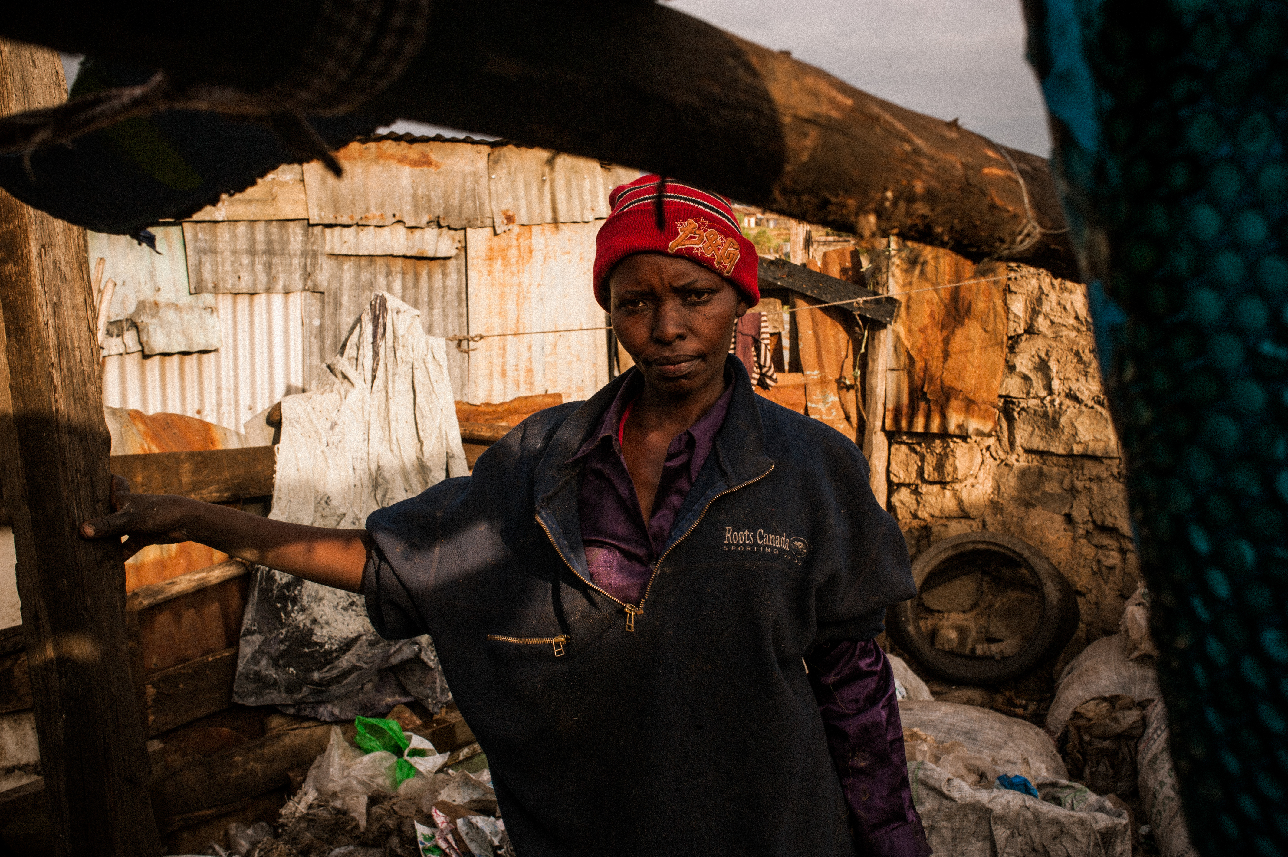 Rahab Rujuru, 42, a mother of six children between the ages of four and seventeen, moved to a small home directly bordering Dandora after the country’s 2007 post-election violence forced her family to leave their Eldoret farm near the western border of Kenya. Image by Micah Albert. Kenya, 2012. Media file: Dandora-8.jpg