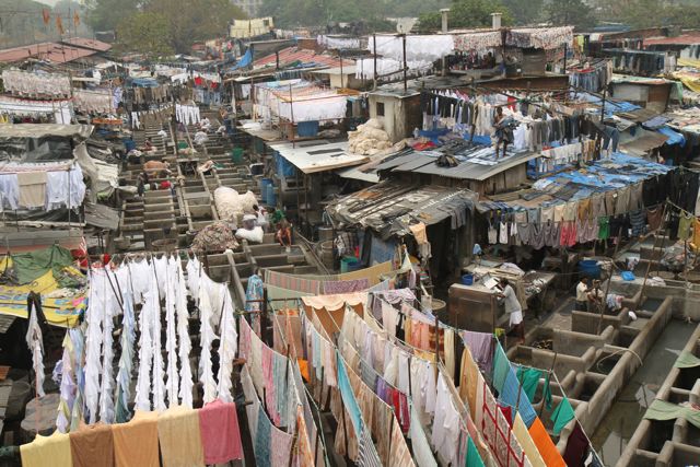 In Dhobi Ghat, in the heart of Mumbai, workers process tens of thousands of pieces of laundry a day, mostly by hand. Jon Sawyer/Pulitzer Center Laundering a city, by hand: Mumbai's Dhobi Ghat