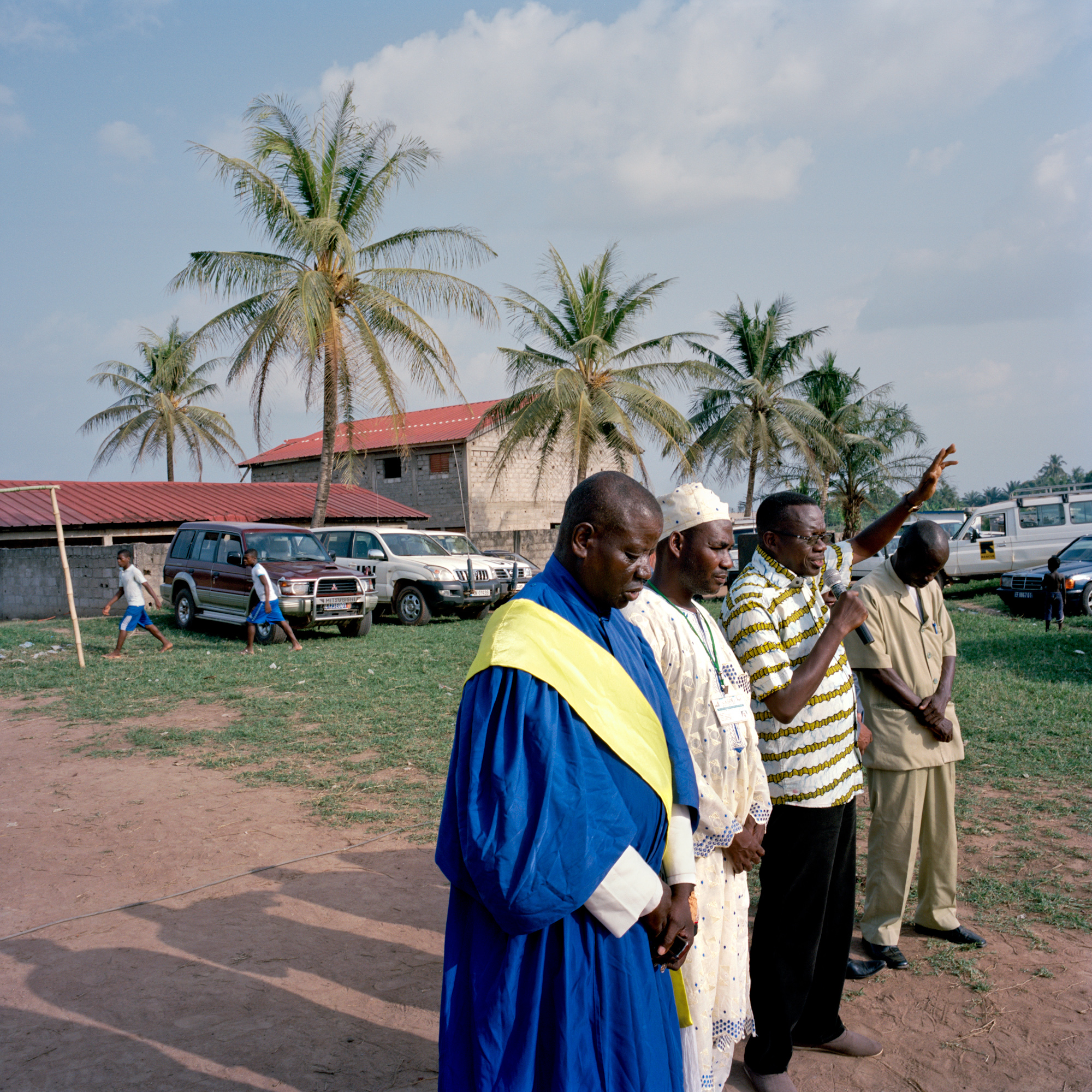 Religious leaders open a reconciliation ceremony in the Carrefour neighborhood of Duekoué, Ivory Coast on March 9, 2012. During last year's post-election violence, Duekoué was the site of heavy fighting and a massacre that killed hundreds, yet the reconciliation event was attended predominantly by community leaders and UN and foreign aid workers, with little participation from local people. Image by Peter DiCampo. Ivory Coast, 2012 Media file: DiCampo-1.jpg
