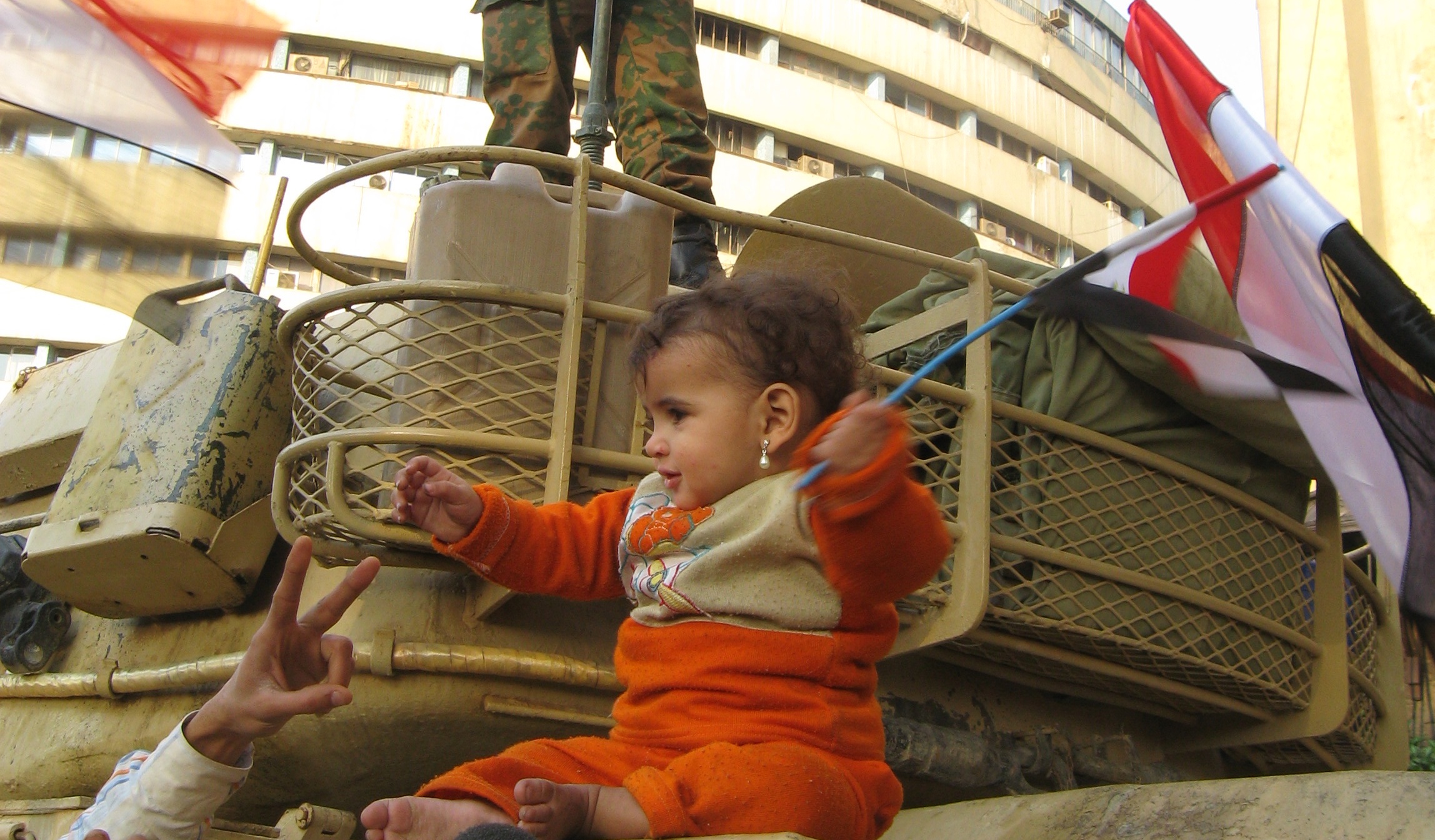A child joins the protesters in Tahrir Square, Cairo. Image by Ellen Knickmeyer. Egypt, 2011. Media file: Egypt_protests_baby_9839.jpg