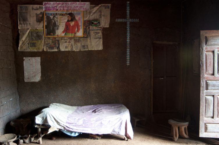 Inside the home of the birth family, not pictured to protect their privacy. Image by Michael Tsegaye. Ethiopia, 2011.