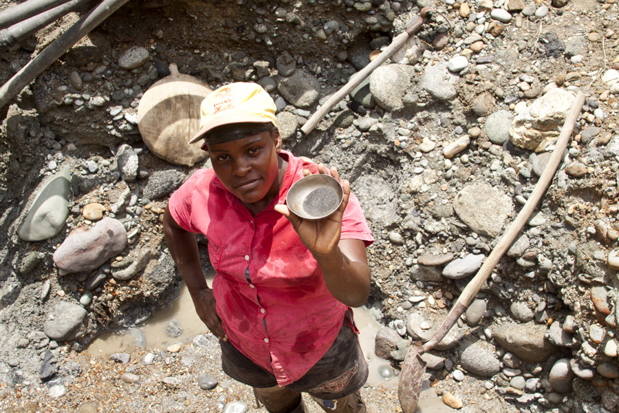 A young 'Green Gold' miner in Tadó, Colombia, shows the bits of gold she gathered after a full day of physical work in her family's small-scale mine. Image by Charlotte de Beauvoir. Colombia, 2011. Media file: GreenGold Photo_PCCR.jpg