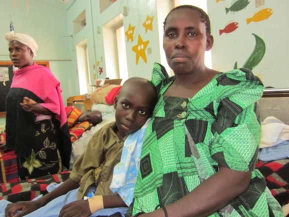 Mother and son in the children's ward at Uganda Cancer Institute in Kampala. Image by Joanne Silberner. Uganda, 2012. Media file: IMG_0031.jpg