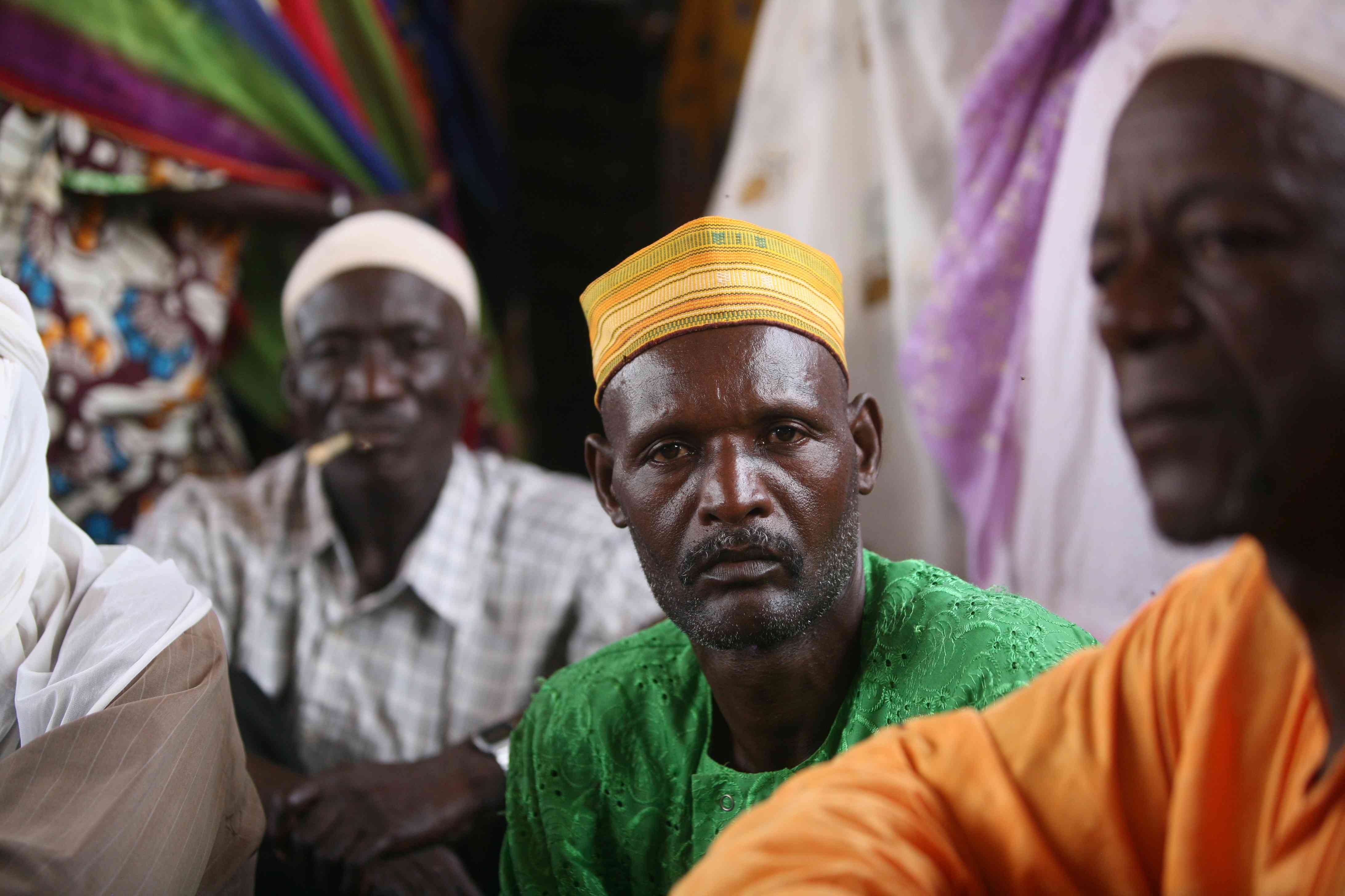 A resident of the village of Adouna, Niger, sits in a meeting with other villagers. Residents say Lutheran World Relief’s project to rebuild a dam near the village will increase usable farmland near the village and provide villagers with a way to get to market, thus increasing incomes. A resident of the village of Adouna, Niger, sits in a meeting with other villagers. Residents say Lutheran World Relief’s project to rebuild a dam near the village will increase usable farmland near the village and provide villagers with a way to get to market, thus increasing incomes.