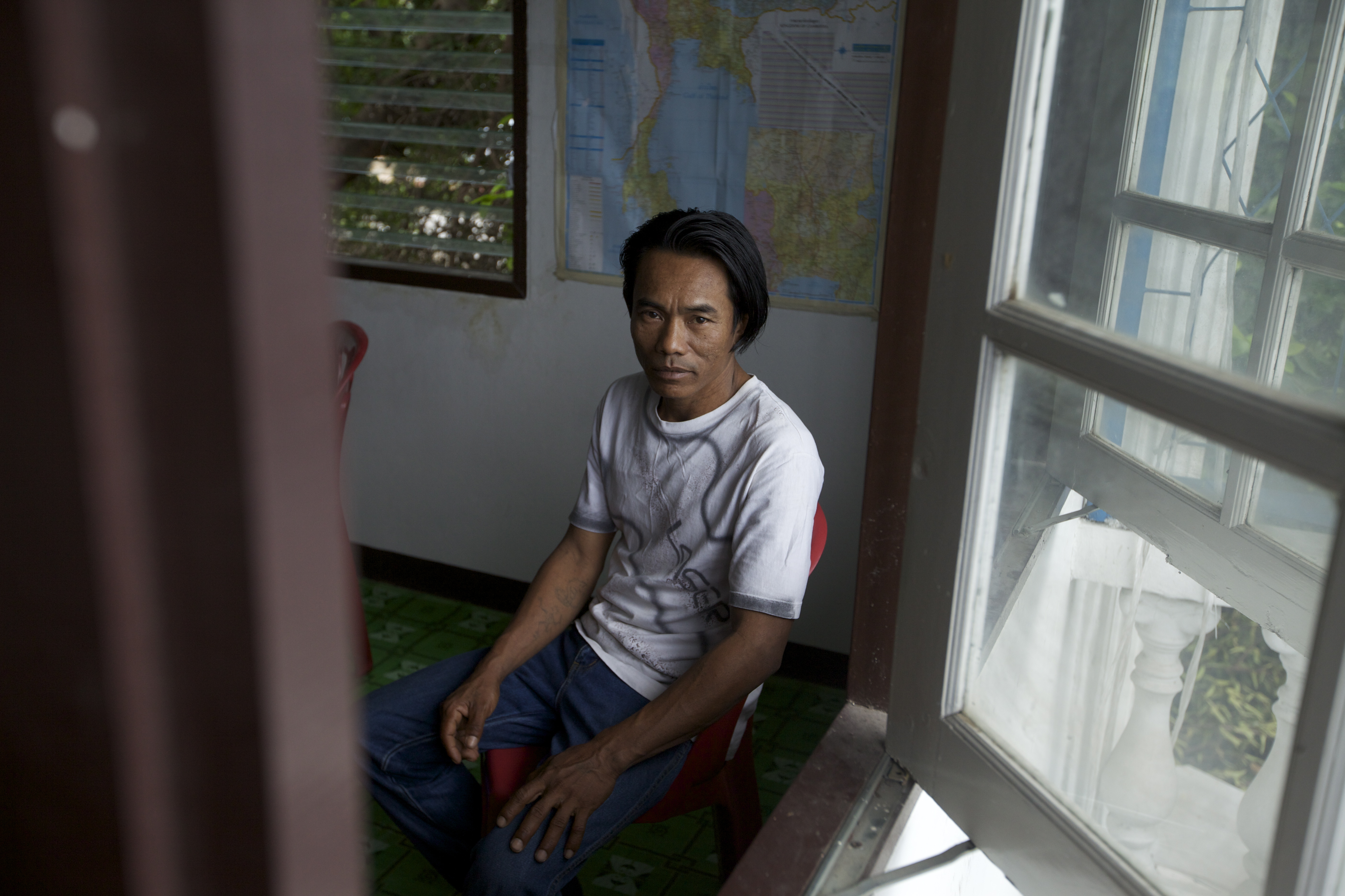 Mi Oo, 46, a Burmese migrant worker rescued in a raid on an unregistered shrimp peeling shed, Samut Sakhon province. Image by Jason Motlagh. Thailand, 2012.
